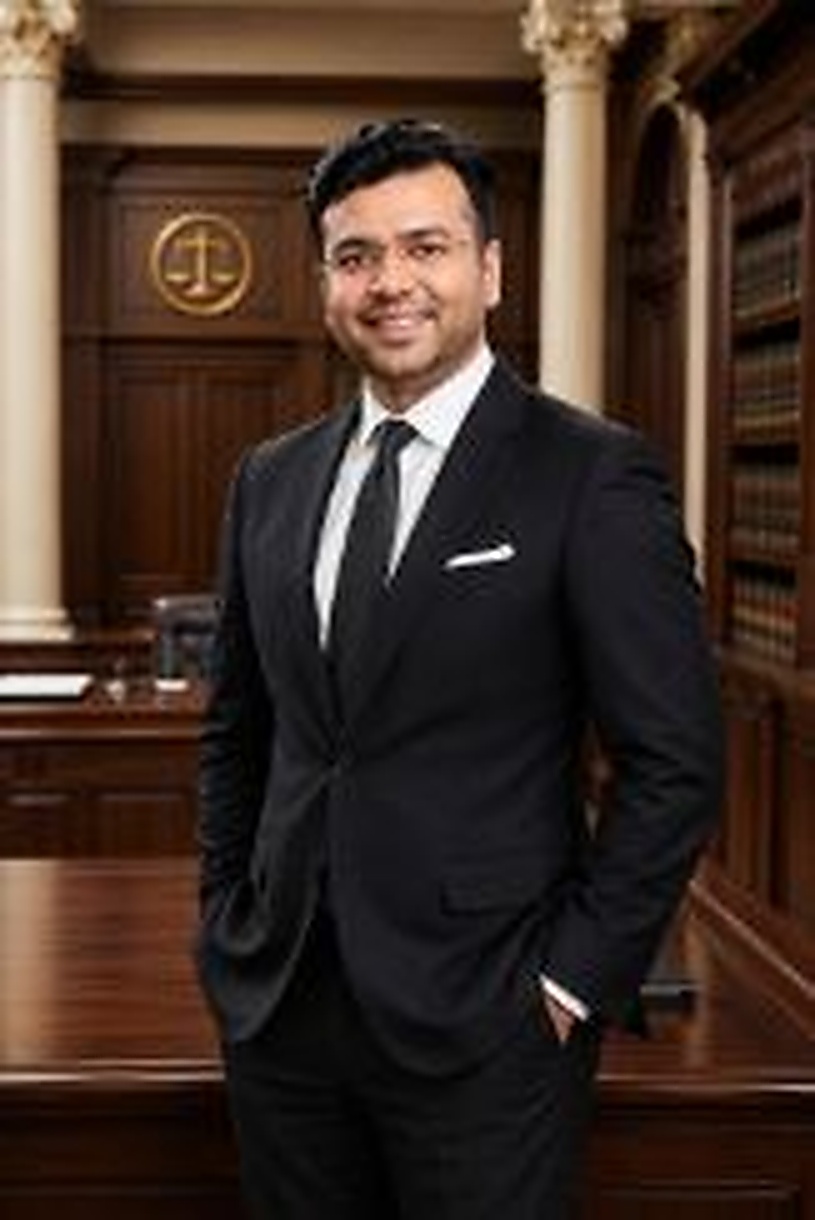 Full-length professional advocate portrait in a courtroom-inspired interior